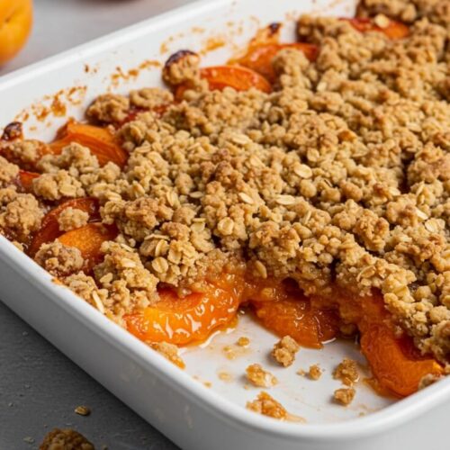 Juicy, golden apricots baked under a buttery oat crumble topping—this comforting dessert is the perfect blend of sweet, tart, and crisp. Serve it warm and bubbling from the oven with a scoop of vanilla ice cream for the ultimate summer indulgence.