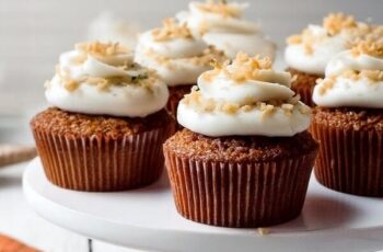 Delight in the warm, spiced flavors of homemade carrot cake cupcakes. These moist and tender cupcakes are filled with freshly grated carrots, crushed pineapple, and a blend of aromatic spices. Each cupcake is topped with a generous swirl of rich, tangy cream cheese frosting and garnished with a sprinkle of chopped pecans for added crunch. Perfect for any occasion, these carrot cake cupcakes are a delicious treat that combines the classic taste of carrot cake in a convenient, portable form.