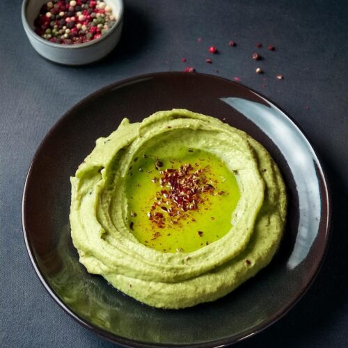 Creamy and smooth Avocado Hummus, a delicious fusion of traditional hummus with the rich, buttery flavor of ripe avocados. This healthy dip is made with chickpeas, tahini, garlic, and lime juice, offering a fresh and vibrant twist on classic hummus. Perfect as a snack or appetizer, serve it with pita bread, veggies, or chips for a flavorful and nutritious treat.