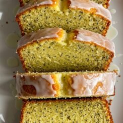 Soft, moist lemon poppy seed bread infused with citrus zest and topped with a sweet glaze for a refreshing bakery-style treat.