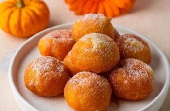Soft and fluffy Mini Pumpkin Donuts packed with warm pumpkin spice flavors and coated in a sweet cinnamon sugar topping. These bite-sized treats are made with real pumpkin puree and a blend of spices, creating the perfect balance of sweetness and spice. Perfect for fall gatherings, breakfast, or a cozy snack, these donuts are both irresistible and easy to make.