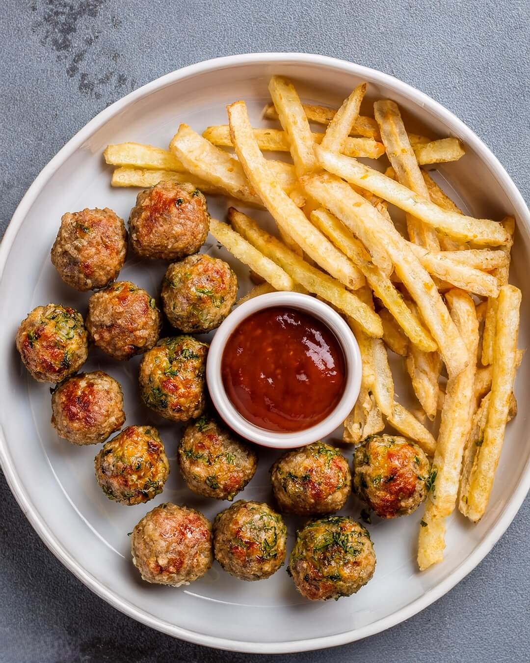 Air Fryer Meatballs are a quick and flavorful way to enjoy a classic dish, with Parmesan, Italian herbs, and breadcrumbs creating a tender, savory bite. The air fryer ensures a crispy exterior and a juicy interior, making these meatballs perfect as a main dish, appetizer, or addition to pasta dishes.