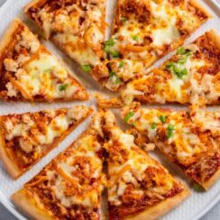 This Buffalo Chicken Pizza is the ultimate fusion of spicy and cheesy goodness! 🍕🔥 Tender chicken tossed in tangy buffalo sauce is layered over a crispy crust, topped with melty mozzarella, and drizzled with creamy ranch or blue cheese dressing. Every bite brings a perfect balance of heat and flavor, making it an exciting twist on pizza night.