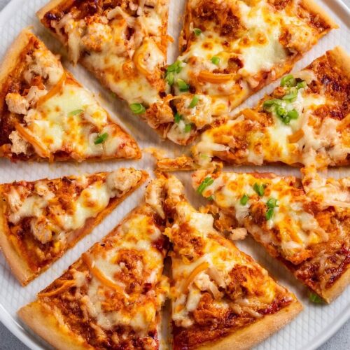 This Buffalo Chicken Pizza is the ultimate fusion of spicy and cheesy goodness! 🍕🔥 Tender chicken tossed in tangy buffalo sauce is layered over a crispy crust, topped with melty mozzarella, and drizzled with creamy ranch or blue cheese dressing. Every bite brings a perfect balance of heat and flavor, making it an exciting twist on pizza night.