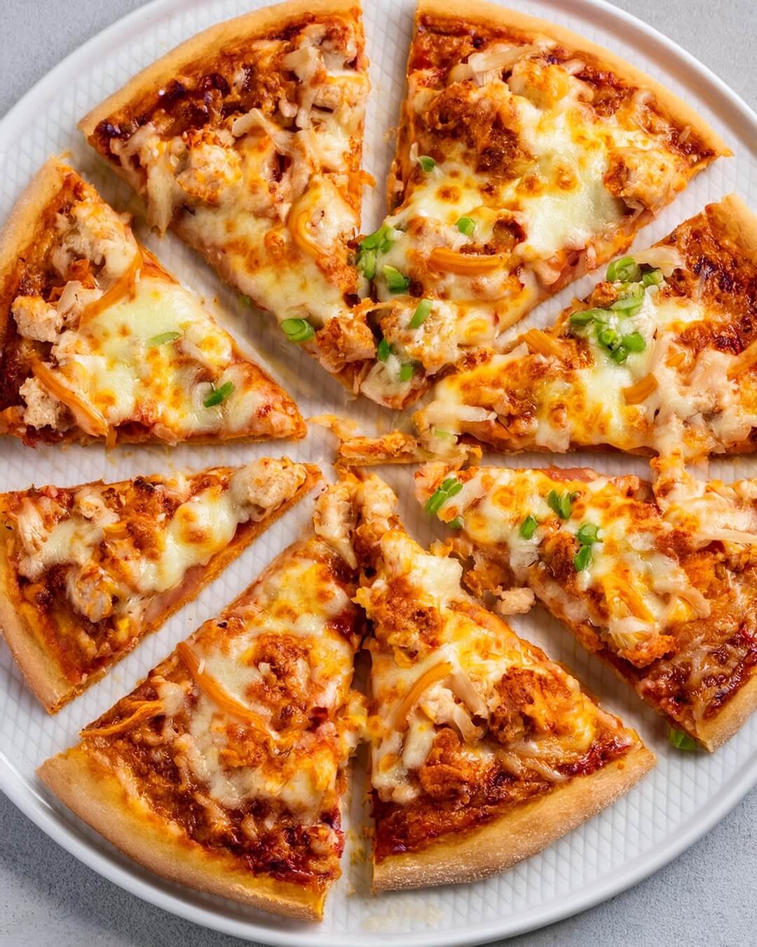 This Buffalo Chicken Pizza is the ultimate fusion of spicy and cheesy goodness! 🍕🔥 Tender chicken tossed in tangy buffalo sauce is layered over a crispy crust, topped with melty mozzarella, and drizzled with creamy ranch or blue cheese dressing. Every bite brings a perfect balance of heat and flavor, making it an exciting twist on pizza night.
