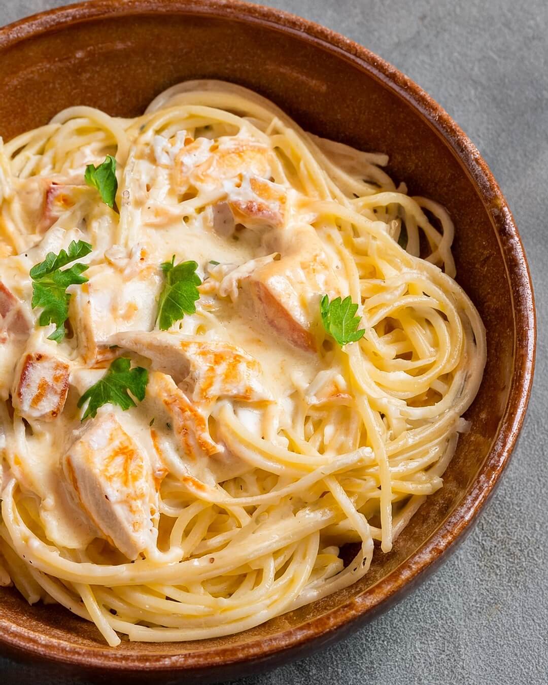 Chicken Spaghetti combines tender chicken, spaghetti, and a creamy, cheesy sauce with subtle heat from tomatoes and chiles, resulting in a comforting, flavorful pasta dish.