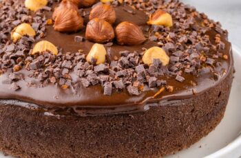 This Chocolate Hazelnut Cake is a decadent treat that combines the rich flavors of chocolate and the nutty goodness of hazelnuts! The moist, tender cake is infused with layers of chocolate and finely ground hazelnuts, creating a perfect balance of sweetness and depth. Topped with a smooth, velvety chocolate ganache and a sprinkle of crunchy hazelnuts, each bite is a luxurious experience. Perfect for special occasions or when you want to indulge, this cake is sure to impress with its rich flavor and beautiful presentation.