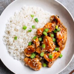 General Tso's Chicken is a delightful combination of crispy chicken coated in a sweet, spicy, and savory sauce, highlighted by fresh green onions and sesame seeds. The balance of flavors makes it a popular choice in Chinese-American cuisine, perfect when served over steamed rice or alongside stir-fried vegetables.