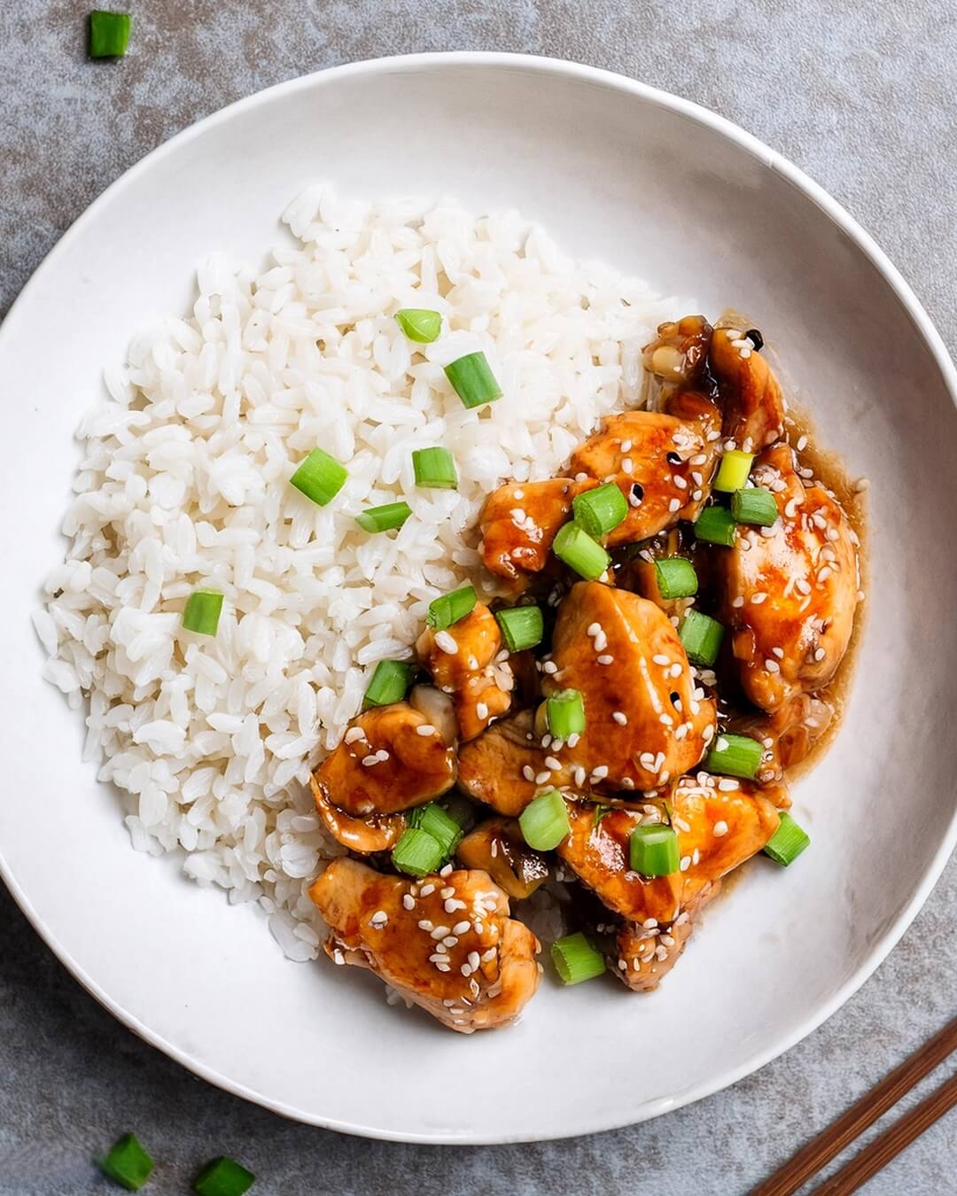 General Tso's Chicken is a delightful combination of crispy chicken coated in a sweet, spicy, and savory sauce, highlighted by fresh green onions and sesame seeds. The balance of flavors makes it a popular choice in Chinese-American cuisine, perfect when served over steamed rice or alongside stir-fried vegetables.