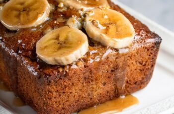 This Maple Banana Bread is a delightful twist on a classic favorite, combining the natural sweetness of ripe bananas with rich maple syrup for a flavor-packed treat! Moist and tender, this banana bread is infused with warm spices like cinnamon and nutmeg, elevating the comforting banana flavor. The addition of crunchy walnuts or pecans adds texture and a nutty depth, making each slice a satisfying experience. Perfect for breakfast, a snack, or a sweet treat any time of day, this maple-infused loaf will fill your kitchen with a warm, inviting aroma. Ready to bake something delicious? Check out the recipe and enjoy a slice of this maple goodness!