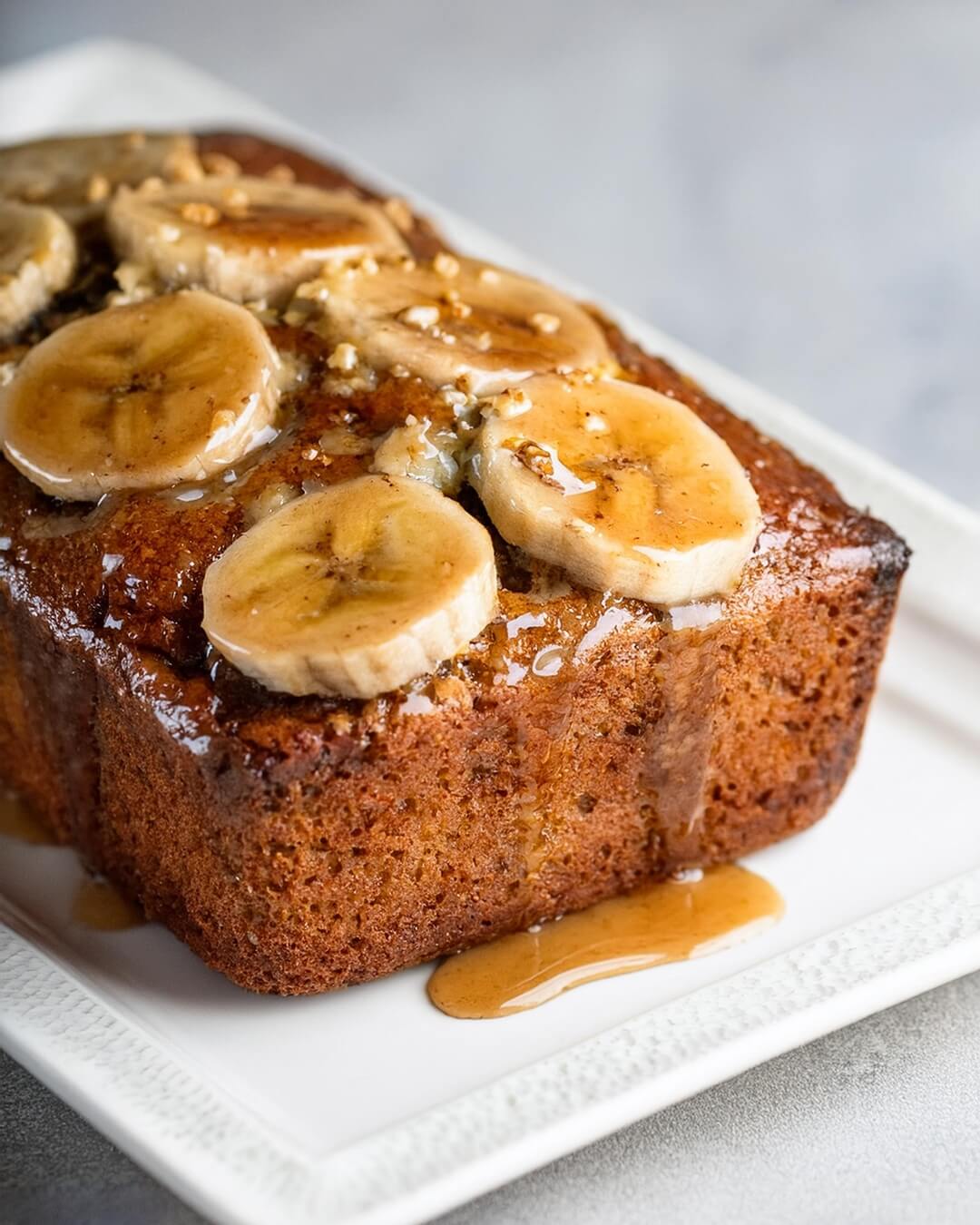 This Maple Banana Bread is a delightful twist on a classic favorite, combining the natural sweetness of ripe bananas with rich maple syrup for a flavor-packed treat! Moist and tender, this banana bread is infused with warm spices like cinnamon and nutmeg, elevating the comforting banana flavor. The addition of crunchy walnuts or pecans adds texture and a nutty depth, making each slice a satisfying experience. Perfect for breakfast, a snack, or a sweet treat any time of day, this maple-infused loaf will fill your kitchen with a warm, inviting aroma. Ready to bake something delicious? Check out the recipe and enjoy a slice of this maple goodness!