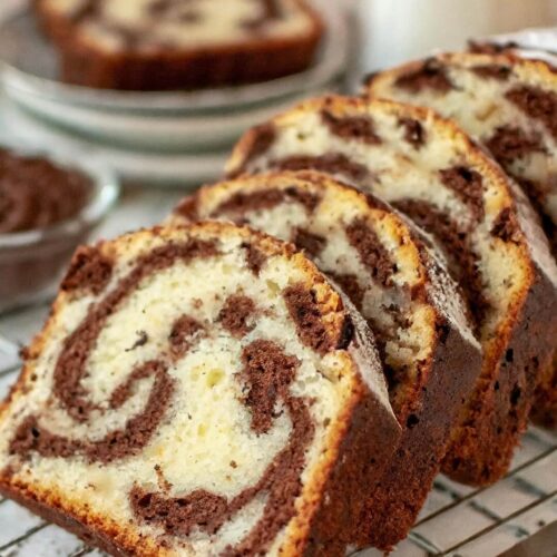 This Chocolate Marble Loaf Cake is a timeless treat suitable for afternoon tea, breakfast, or dessert. The cake, featuring a classic combination of half vanilla and half chocolate, made with yogurt, evokes nostalgic memories of a childhood favorite that you never grow tired of enjoying!
