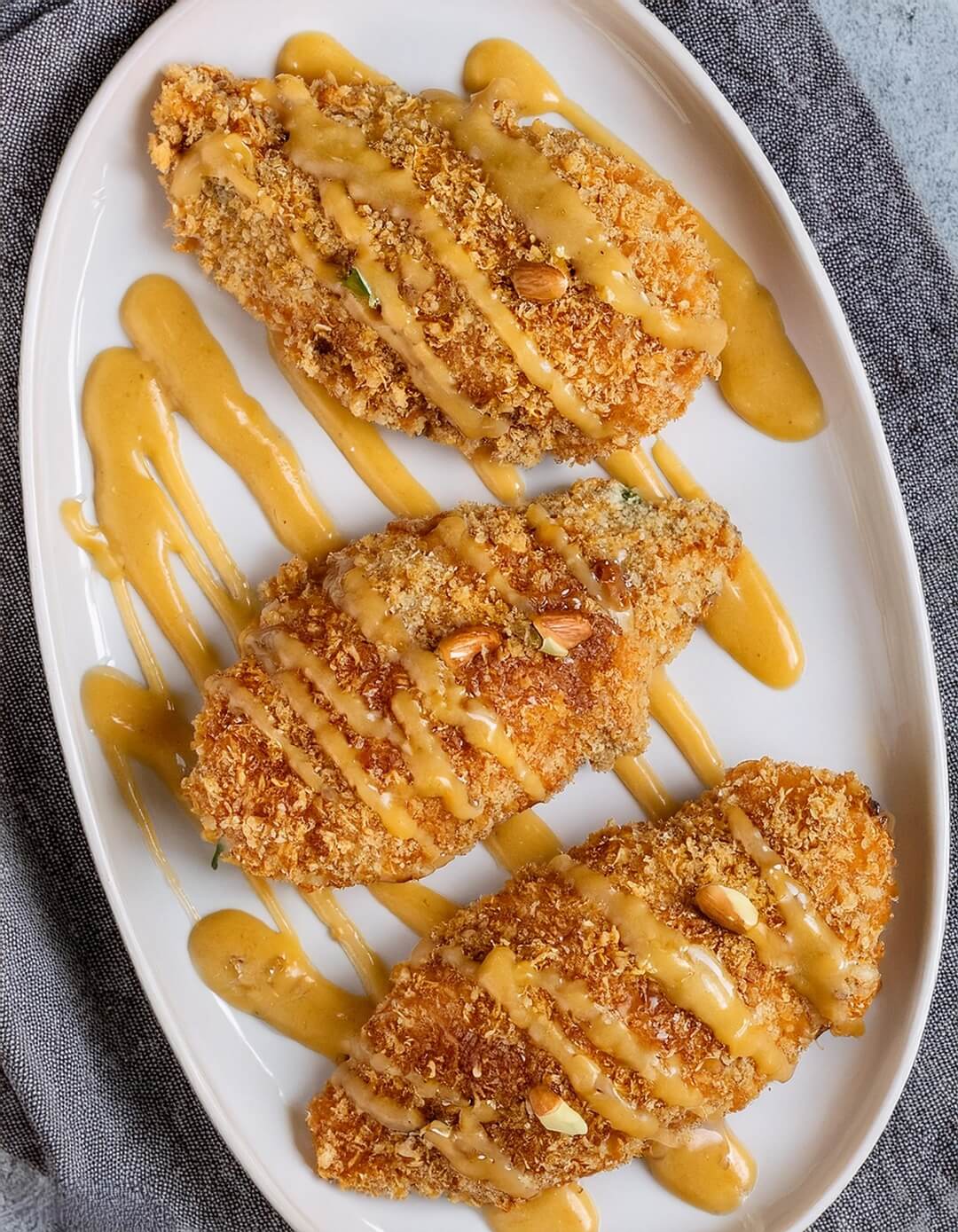 Pecan Crusted Chicken is a delightful dish that pairs juicy chicken breasts with a crispy pecan coating, all brought together with a tangy honey mustard glaze. Ideal for weeknight dinners or special gatherings, this recipe will impress family and friends alike.