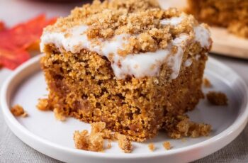 This Pumpkin Coffee Cake is the perfect fall treat, combining warm pumpkin spice flavors with a crumbly, buttery streusel topping! The moist and tender cake is infused with pumpkin puree, cinnamon, and nutmeg, creating a comforting flavor that’s perfect for the season. Topped with a sweet cinnamon-sugar streusel and a light drizzle of glaze, every bite has the perfect balance of sweetness and spice. Whether enjoyed with your morning coffee or as an afternoon snack, this coffee cake is sure to be a seasonal favorite.