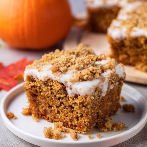 This Pumpkin Coffee Cake is the perfect fall treat, combining warm pumpkin spice flavors with a crumbly, buttery streusel topping! The moist and tender cake is infused with pumpkin puree, cinnamon, and nutmeg, creating a comforting flavor that’s perfect for the season. Topped with a sweet cinnamon-sugar streusel and a light drizzle of glaze, every bite has the perfect balance of sweetness and spice. Whether enjoyed with your morning coffee or as an afternoon snack, this coffee cake is sure to be a seasonal favorite.
