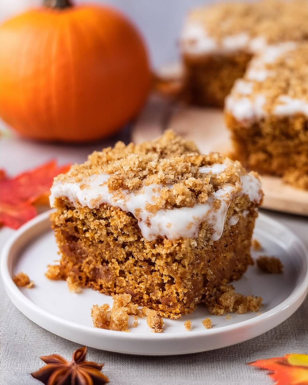 This Pumpkin Coffee Cake is the perfect fall treat, combining warm pumpkin spice flavors with a crumbly, buttery streusel topping! The moist and tender cake is infused with pumpkin puree, cinnamon, and nutmeg, creating a comforting flavor that’s perfect for the season. Topped with a sweet cinnamon-sugar streusel and a light drizzle of glaze, every bite has the perfect balance of sweetness and spice. Whether enjoyed with your morning coffee or as an afternoon snack, this coffee cake is sure to be a seasonal favorite.