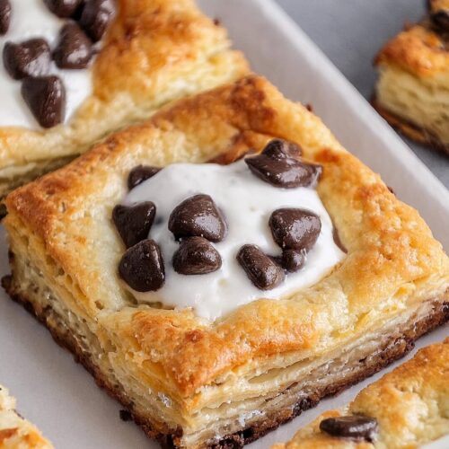 These Ricotta Chocolate Chip Pastries are a delightful mix of creamy, sweet ricotta and decadent chocolate chips wrapped in flaky pastry! The filling, made with smooth ricotta and mini chocolate chips, is lightly sweetened and nestled inside layers of buttery, golden pastry that bakes to perfection. Each bite offers a balance of creamy, rich filling and crisp pastry, making them perfect for breakfast, dessert, or a sweet snack.
