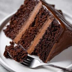 This Triple Layer Chocolate Cake is the ultimate treat for chocolate lovers! Three moist, rich layers of decadent chocolate cake are stacked high, each one filled with creamy, velvety chocolate frosting. The cake is then generously frosted with more luscious chocolate, creating a stunning, indulgent dessert that’s perfect for any celebration. Whether it’s a special occasion or a sweet indulgence, each bite is a pure, chocolatey dream with just the right balance of sweetness and richness.