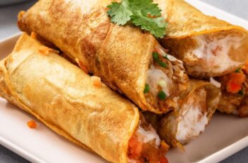 These Chicken Flautas are crispy, golden rolls filled with seasoned chicken, melted cheese, and mild green chiles. Serve them with sour cream, guacamole, pico de gallo, and salsa for a complete meal full of flavors and textures—perfect for snacking or as an appetizer!