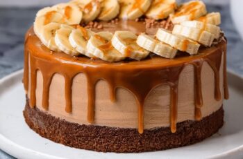 Rich, velvety chocolate cake meets a dreamy caramel frosting in this Chocolate Caramel Cake. Each bite is layered with the deep flavors of cocoa and buttery caramel, creating a dessert that's as indulgent as it is irresistible. Perfect for special occasions or a cozy treat, this cake is sure to bring smiles all around!