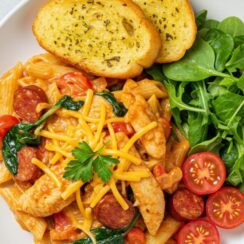 This creamy Cajun Chicken Pasta is loaded with spicy seasoning, tender chicken, and a rich garlic cream sauce—perfect for quick weeknight dinners, date night at home, or meal prepping with flavor.
