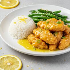 Golden, crispy chicken coated in a zesty lemon glaze—this Chinese lemon chicken is quick, fresh, and better than takeout in just 30 minutes!