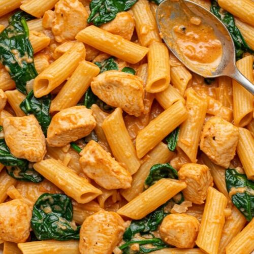 This Tuscan Chicken Pasta is creamy, garlicky, and packed with sun-dried tomatoes and spinach—perfect for cozy weeknights, date-night dinners, or impressing guests without stress.