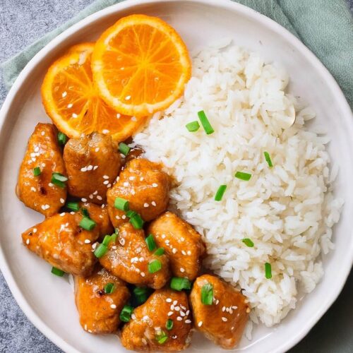 The Lighter Orange Chicken features tender, diced chicken breasts sautéed in a light canola oil, then coated in a sweet and tangy orange sauce made with fresh orange juice, honey, soy sauce, and a touch of Sriracha for heat. The sauce is thickened with cornstarch for a glossy finish and served with a sprinkle of green onions and sesame seeds for extra texture and flavor. It’s a healthier take on a classic dish, with all the citrusy sweetness and savory depth you crave!