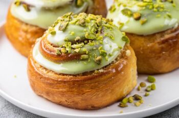 Pistachio Cinnamon Rolls with Pistachio Cream Cheese Icing are a gourmet twist on traditional cinnamon rolls, featuring a luscious pistachio filling and a creamy pistachio-infused icing. Perfect for breakfast, brunch, or a sweet snack, these rolls are sure to impress.