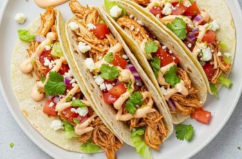 Tender shredded chicken tucked into warm tortillas with your favorite toppings—this taco recipe is fresh, fast, and delicious, and it’s done in just 25 minutes!