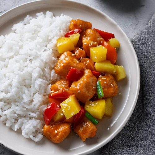 This Sweet and Sour Chicken is a colorful and flavorful dish that pairs crispy chicken with a tangy sauce and vibrant vegetables. The combination of pineapple, red bell peppers, and a zesty sauce makes it a standout, perfect for serving over rice for a satisfying meal.