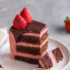 Chocolate Strawberry Cake layers a moist, rich chocolate base with a creamy, fresh strawberry buttercream. Topped with a glossy ganache and garnished with vibrant strawberries, this cake is a celebration of chocolate and fruit, perfect for any special occasion or indulgent dessert craving!