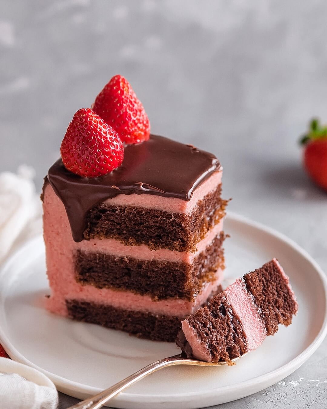 Chocolate Strawberry Cake layers a moist, rich chocolate base with a creamy, fresh strawberry buttercream. Topped with a glossy ganache and garnished with vibrant strawberries, this cake is a celebration of chocolate and fruit, perfect for any special occasion or indulgent dessert craving!