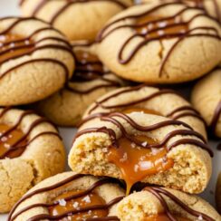 These Twix Thumbprint Cookies are filled with gooey caramel and topped with rich chocolate for the ultimate bite. It’s perfect for parties, holidays, and dessert tables.