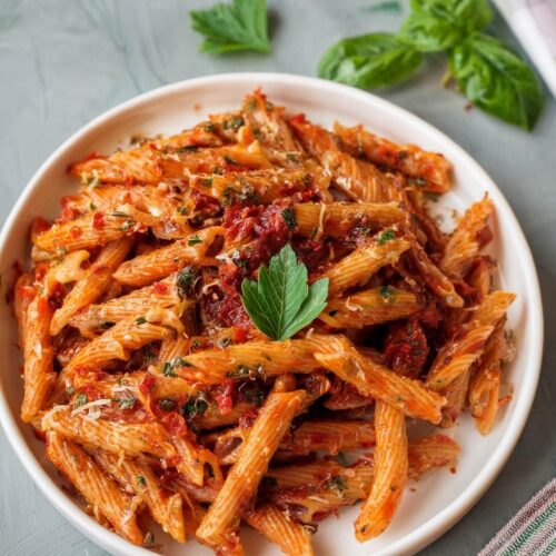 Sun-Dried Tomato Pasta combines rich, creamy sauce with the vibrant flavors of sun-dried tomatoes and fresh spinach. The tangy, savory sauce is balanced with a touch of heat, parmesan, and basil for a comforting and flavorful dish. Ideal for a quick, satisfying dinner that’s both hearty and fresh!