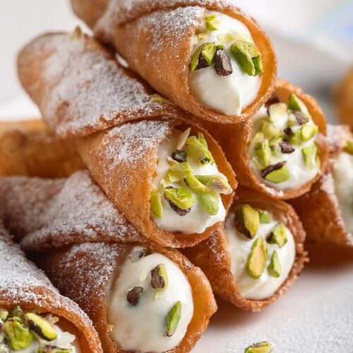 Cannoli are crispy, golden pastry shells filled with a rich ricotta cream, chocolate chips, and a hint of cinnamon—an irresistible Italian classic!