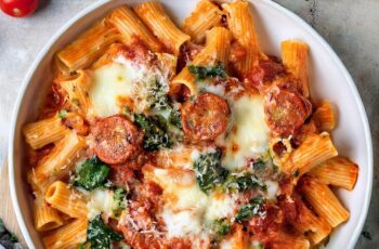This Cheesy Baked Rigatoni is the ultimate comfort dish with savory sausage, gooey mozzarella, roasted tomatoes, and a rich marinara sauce baked to perfection!