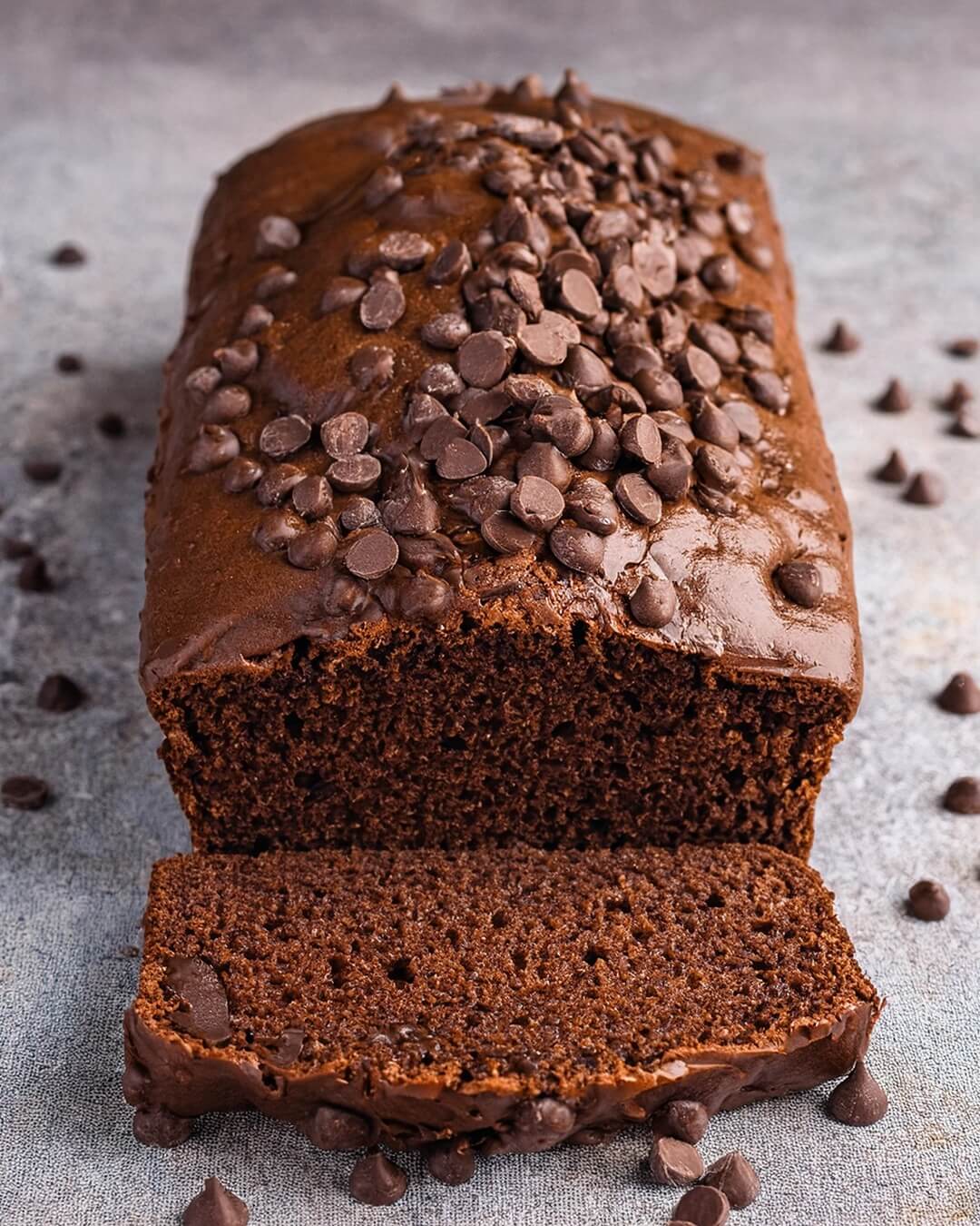This Chocolate Loaf Cake is rich, moist, and loaded with deep cocoa flavor, melty chocolate chips, and a hint of espresso for the ultimate indulgence!