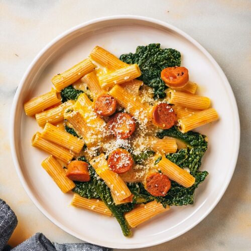 Creamy Pumpkin Pasta with Italian sausage, fresh sage, and kale in a velvety pumpkin sauce. Cozy, comforting, and packed with fall flavors in every bite!