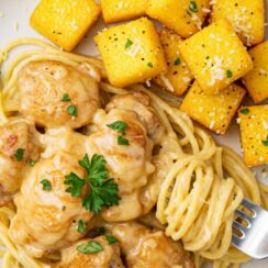 Tender chicken, spaghetti, and creamy cheese come together in this slow-cooker recipe for the ultimate comfort meal.