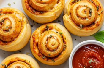 These homemade pizza rolls are stuffed with gooey mozzarella, zesty marinara, and optional pepperoni for the ultimate snack.
