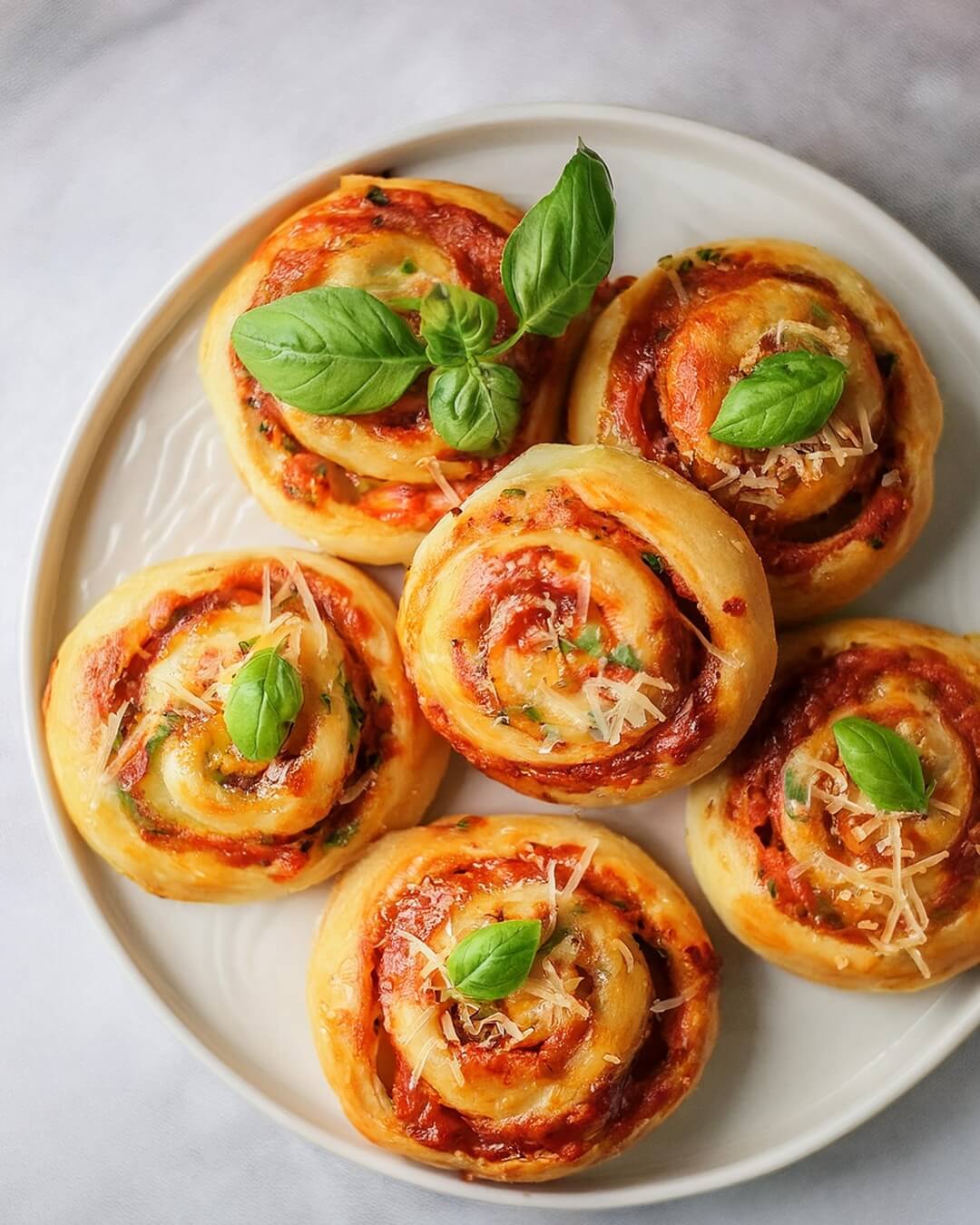These Pizza Rolls are loaded with gooey mozzarella, zesty sauce, and optional pepperoni, all wrapped in soft pizza dough and baked to perfection. The ultimate snack!