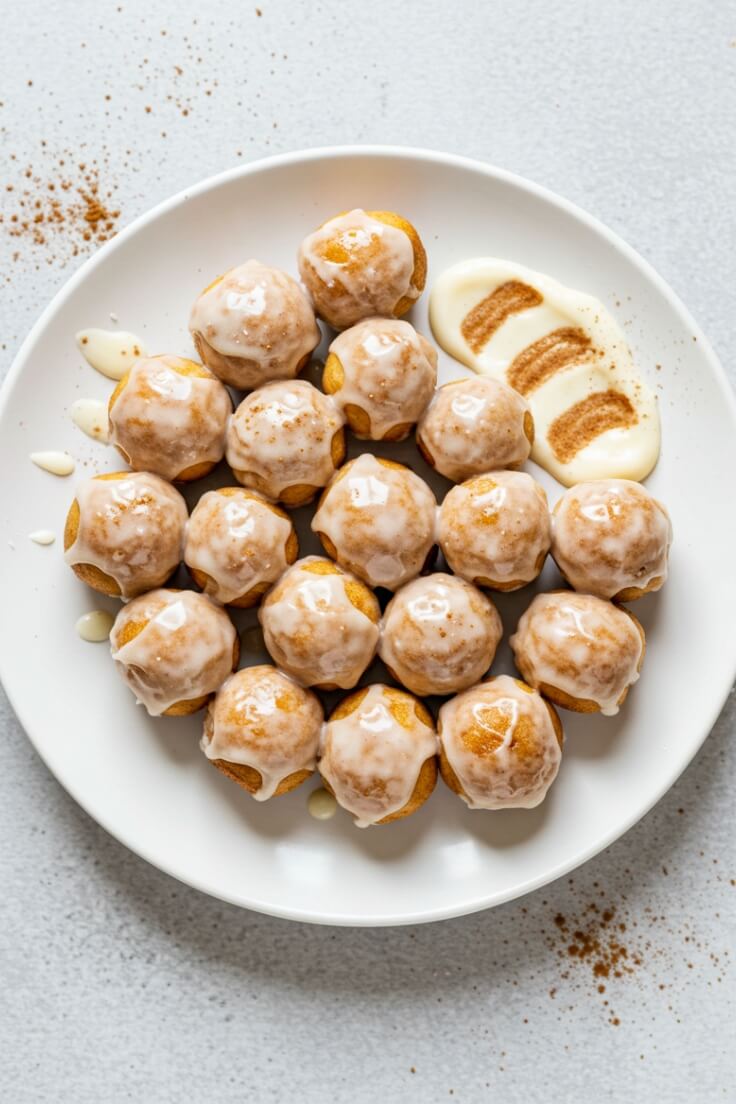 Mini cinnamon roll bites with gooey centers, swirled perfection, and topped with vanilla glaze—easy to make and perfect for breakfast or snack!