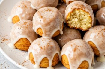 Mini cinnamon roll bites with gooey centers, swirled perfection, and topped with vanilla glaze—easy to make and perfect for breakfast or snack!