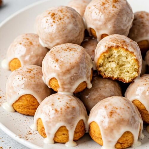 Mini cinnamon roll bites with gooey centers, swirled perfection, and topped with vanilla glaze—easy to make and perfect for breakfast or snack!