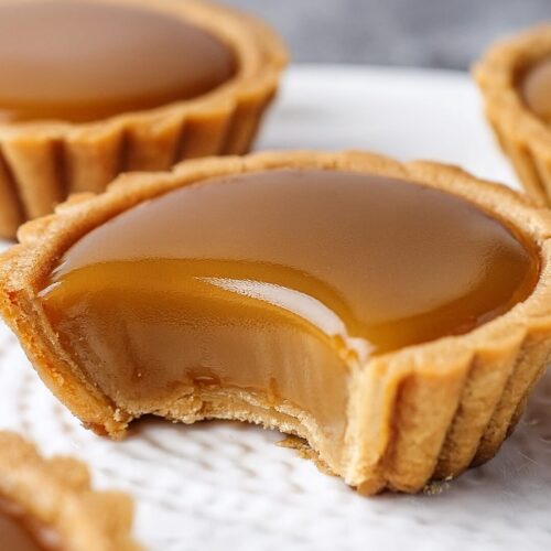 These Mini Butterscotch Tarts have a buttery, flaky crust filled with rich, velvety butterscotch and a hint of sea salt—pure indulgence in every bite!