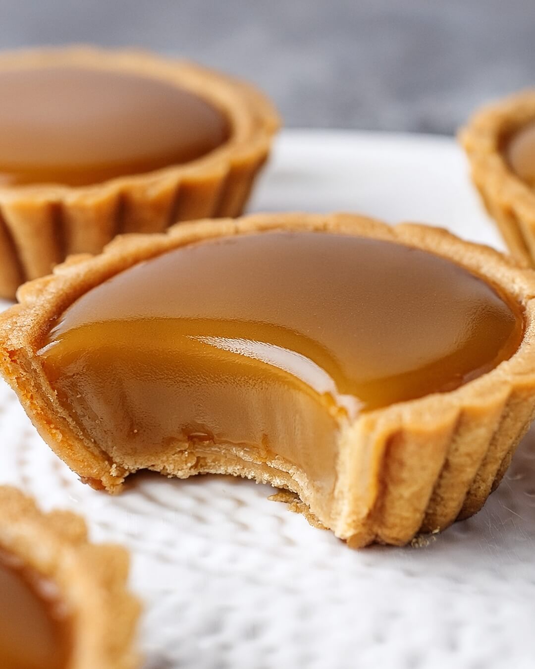 These Mini Butterscotch Tarts have a buttery, flaky crust filled with rich, velvety butterscotch and a hint of sea salt—pure indulgence in every bite!