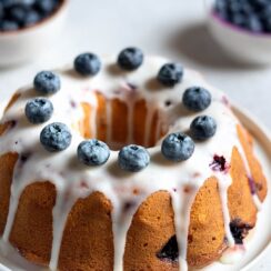 This Blueberry Bundt Cake is buttery, soft, and packed with juicy berries, finished with a sweet vanilla glaze that melts in your mouth!