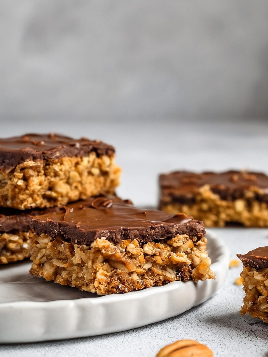 These No Bake Chocolate Peanut Butter Oatmeal Bars are naturally sweetened, packed with oats, and topped with dark chocolate bliss