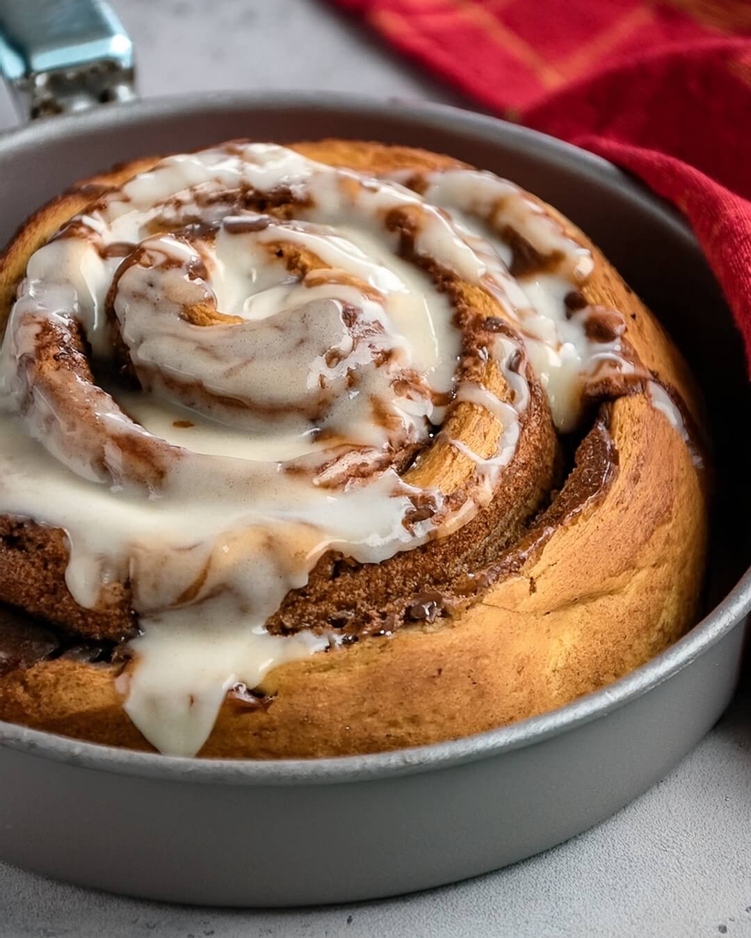 Giant Cinnamon Roll with Cream Cheese Frosting is the ultimate cozy indulgence—a supersized version of the classic breakfast favorite, swirled with cinnamon sugar and topped with rich, tangy cream cheese frosting. This stunning treat is soft, gooey, and perfect for sharing!
